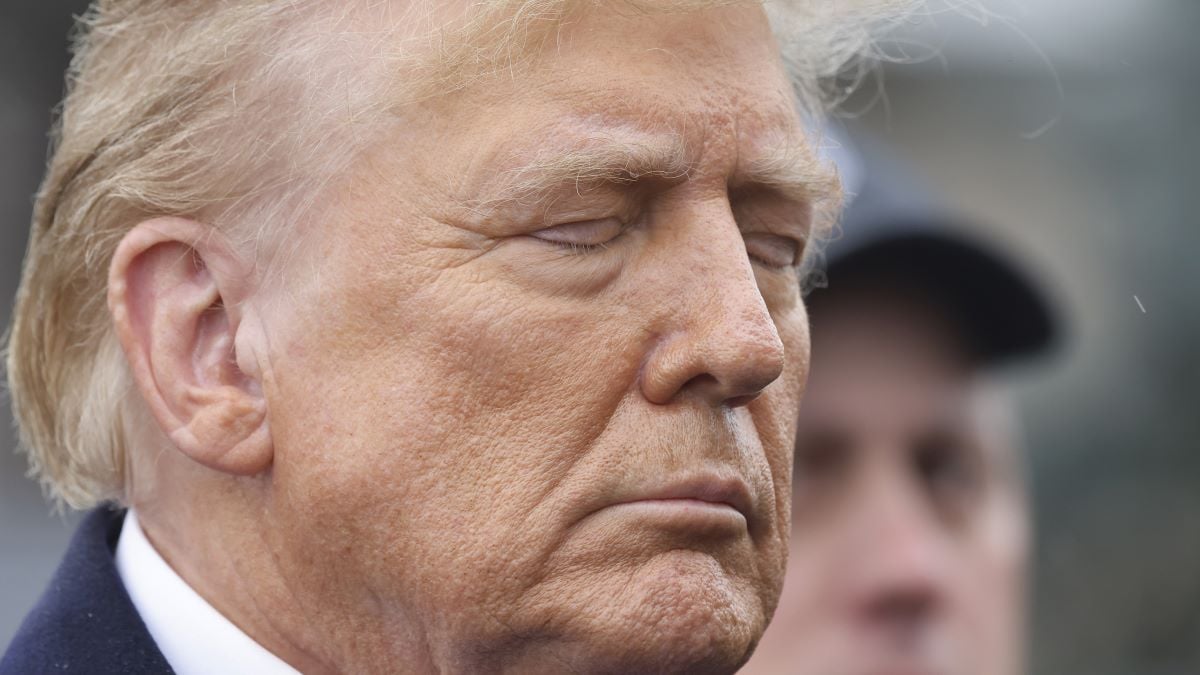 Former President Donald Trump stands silently after giving a brief statement after attending the wake for slain NYPD Officer Jonathan Diller at the Massapequa Funeral Home on March 28, 2024 in Massapequa, New York. Officer Diller was killed on March 25th when he was shot in Queens after approaching an illegally parked vehicle. Two suspects have been arrested and charged, and are being held without bail for the killing. (Photo by Michael M. Santiago/Getty Images)