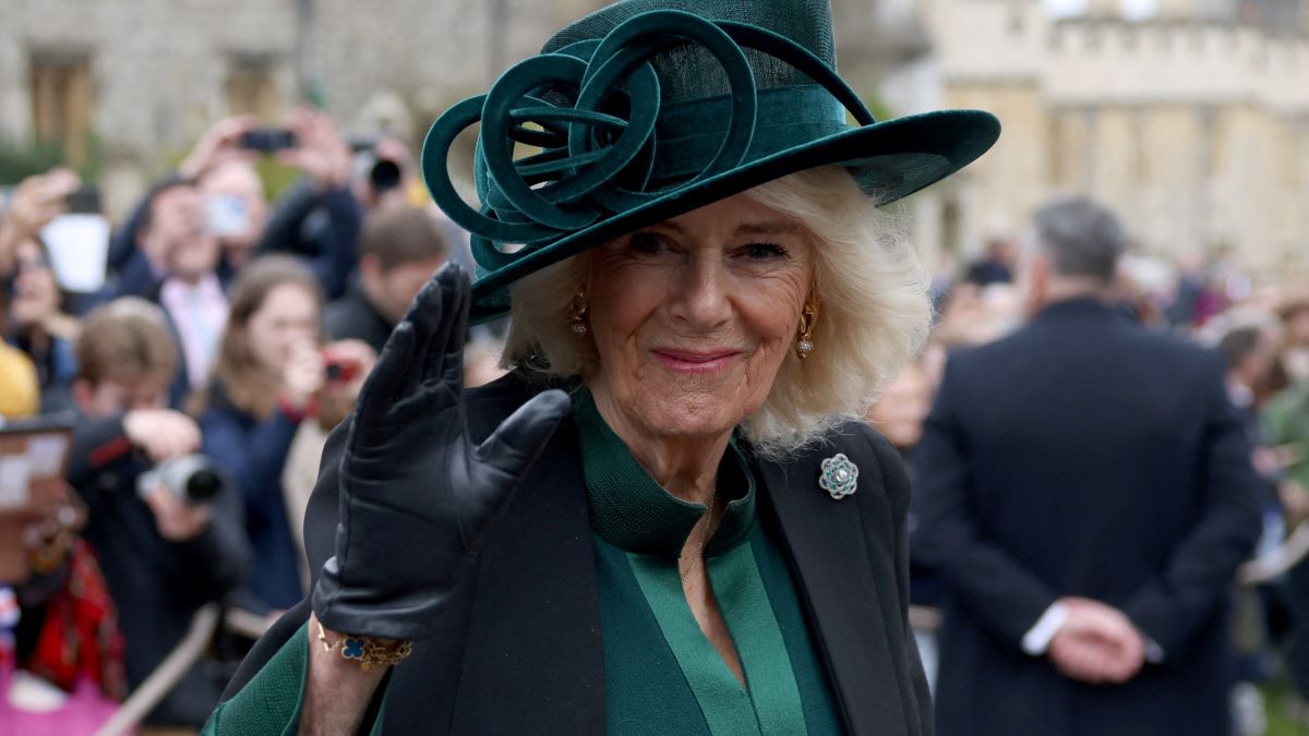 Queen Camilla waves to people after attending the Easter Mattins Service at Windsor Castle on March 31, 2024 in Windsor, England. (Photo by Hollie Adams - WPA Pool/Getty Images)