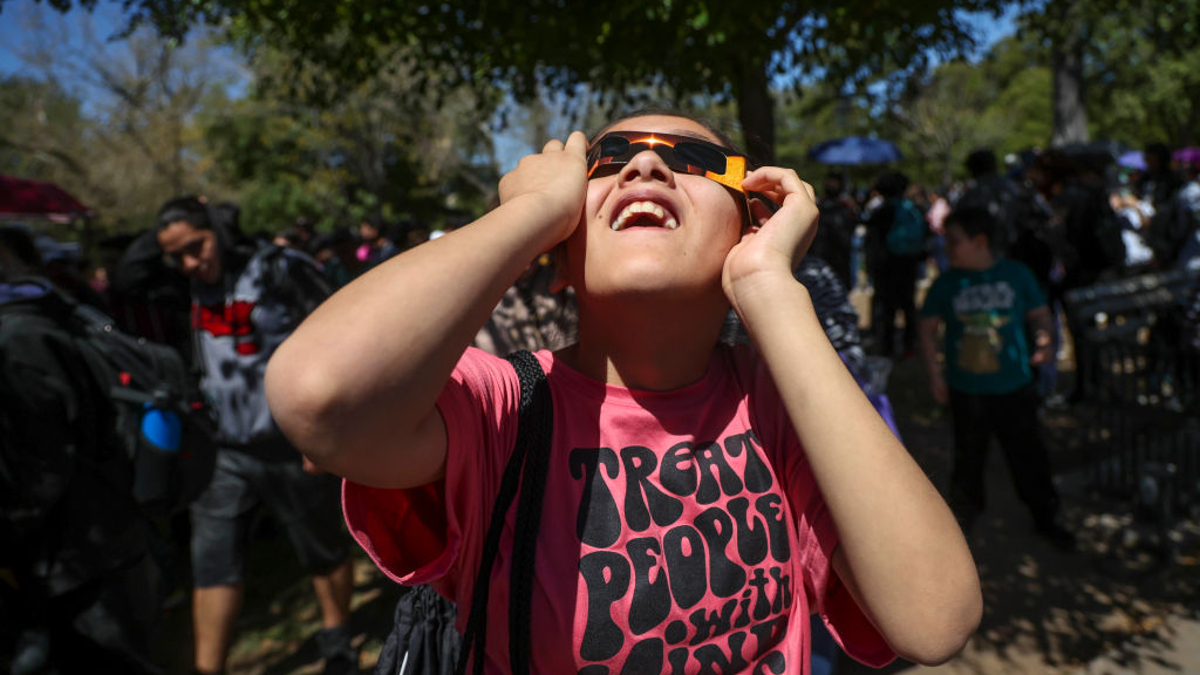 A student watches the eclipse at University of Sonora on April 8, 2024 in Hermosillo, Mexico. Millions of people have flocked to areas across North America that are in the "path of totality" in order to experience a total solar eclipse. During the event, the moon will pass in between the sun and the Earth, appearing to block the sun.