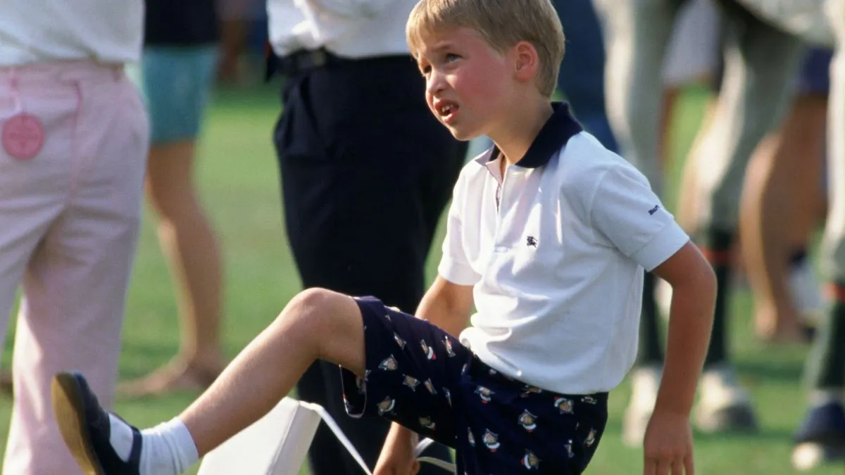 Prince William Playing With Princess Diana's Handbag At Cartier International Polo Day At Smiths Lawn Polo Club. (Photo by Tim Graham Photo Library via Getty Images)