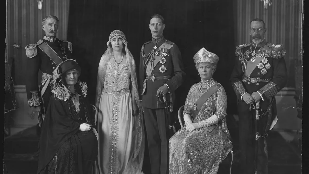 Albert and Elizabeth, the Duke and Duchess of York, on their wedding day. They are the future King George VI and Queen Elizabeth of England. Seated to the left of the couple are the bride's parents Claude and Cecilia Bowes-Lyon, Earl and Countess of Strathmore, and to their right are the groom's parents, King George V and Queen Mary of England. (Photo by © Hulton-Deutsch Collection/CORBIS/Corbis via Getty Images)