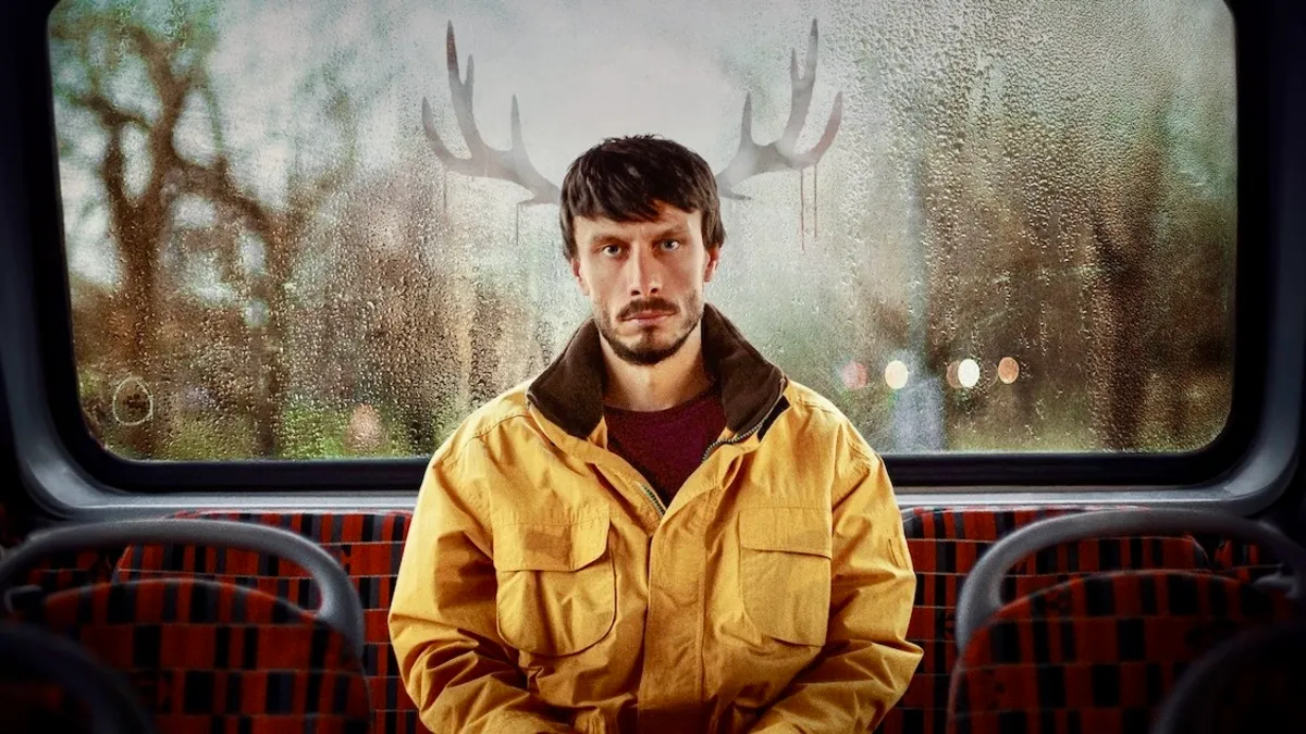 Richard Gadd sits at the back of a British bus in a promotional image for Netflix’s ‘Baby Reindeer’