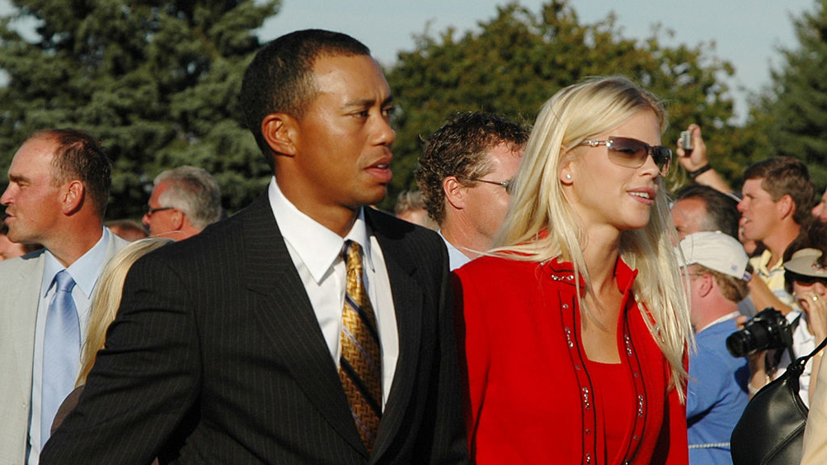 Tiger Woods and his girlfriend, Elin Nordegren, leave the stage after opening ceremonies at the 2004 Ryder Cup in Detroit, Michigan, September 16, 2004. 