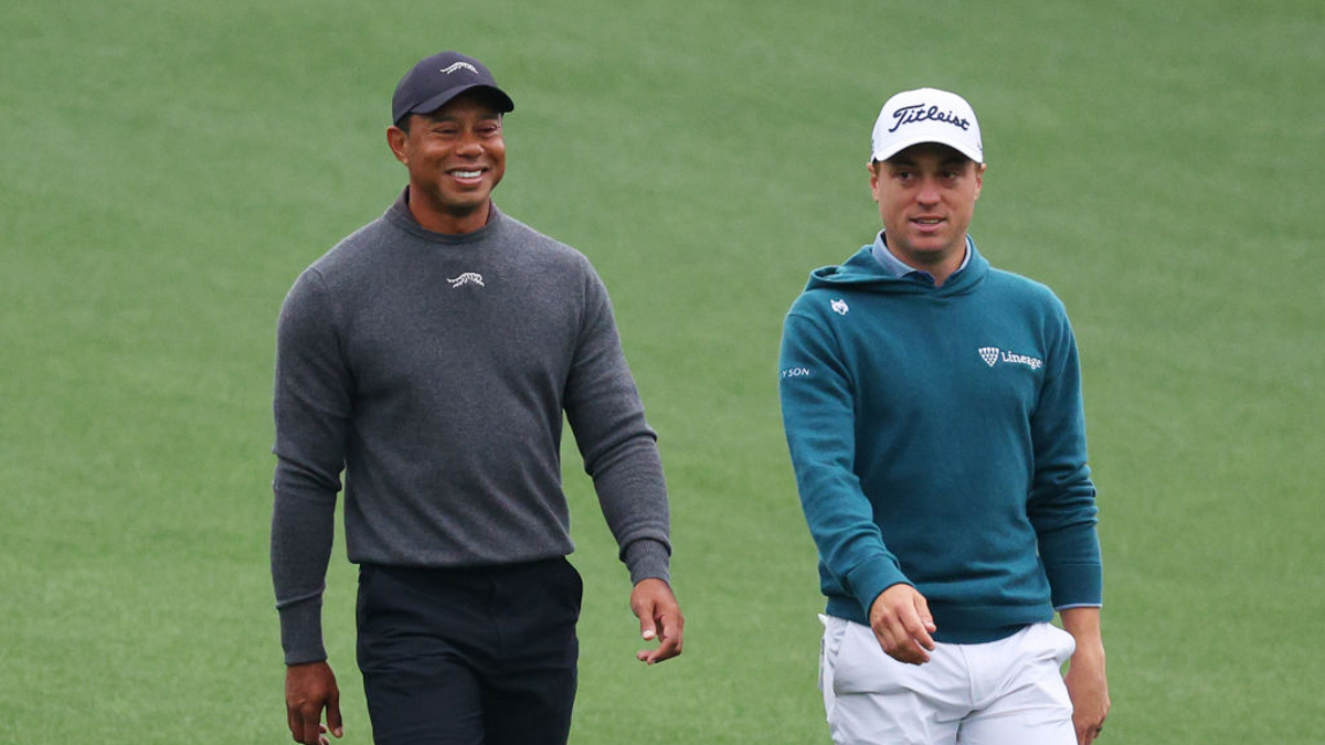 Tiger Woods of the United States and Justin Thomas of the United States walk down the first fairway during a practice round prior to the 2024 Masters Tournament at Augusta National Golf Club on April 09, 2024 in Augusta, Georgia. 