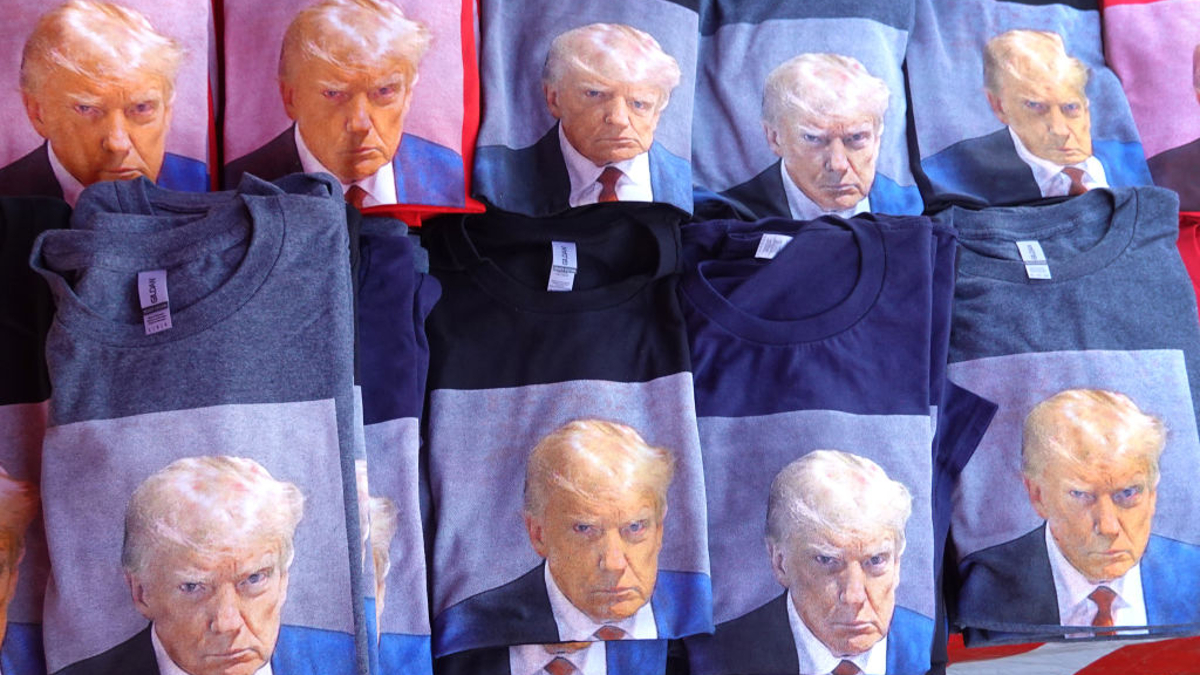 A vendor sells t-shirts featuring a mugshot of Republican presidential candidate former President Donald Trump outside of theMonument Arena on September 08, 2023 in Rapid City, South Dakota. Trump is scheduled to speak today at the arena during the Monument Leaders Rally hosted by the South Dakota Republican Party.