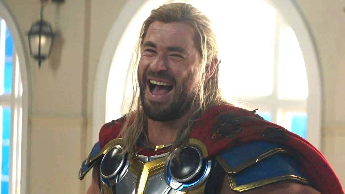 Thor (Chris Hemsworth) laughing in Thor: Love and Thunder