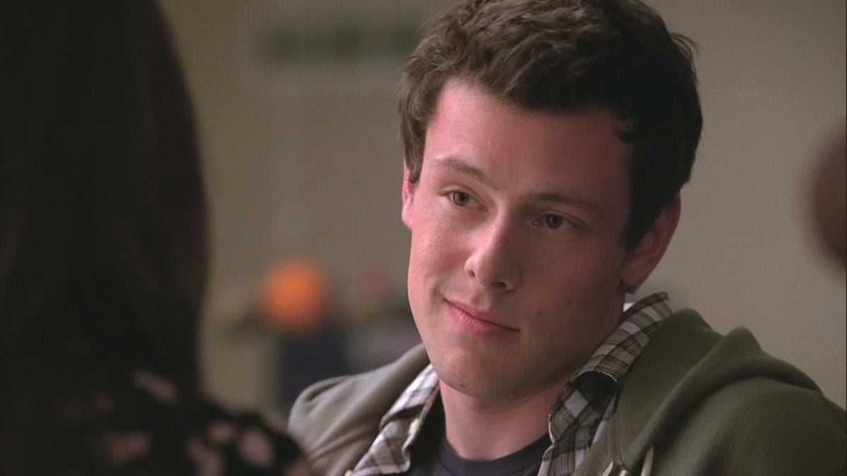 Finn Hudson smiling in the early seasons of Glee