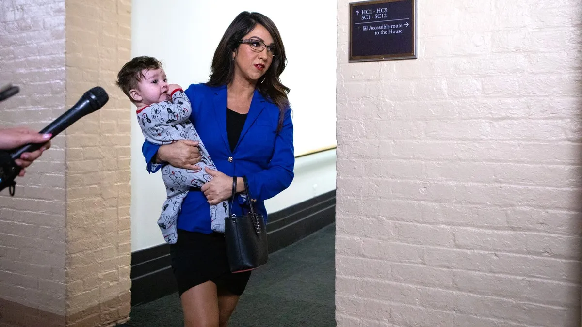 Rep. Lauren Boebert (R-CO) holds her grandchild as she speaks to reporters upon arrival to a House Republican Conference meeting on November 14, 2023 in Washington, DC. The House is working through a Continuing Resolution presented by Speaker of the House Mike Johnson (R-LA) to avoid government shutdown on November 17.
