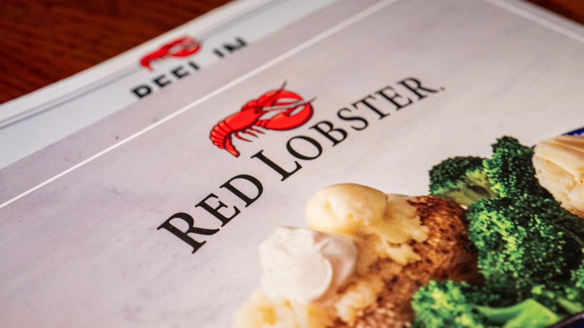 In this photo illustration, a menu is displayed on a plate at a Red Lobster restaurant on May 20, 2024 in Austin, Texas. Red Lobster has filed for Chapter 11 bankruptcy protection after a failed lease-back agreement and "endless shrimp" promotion backfired against company revenue. (Photo Illustration by Brandon Bell/Getty Images)