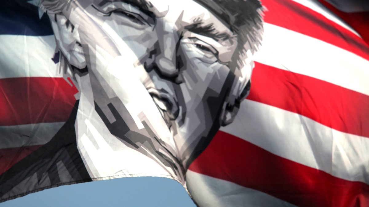 A flag featuring former US President and Republican presidential candidate Donald Trump waves amid a small group of supporters near Mar-a-Lago on May 30, 2024 in Palm Beach, Florida. The former president was found guilty in Manhattan on all 34 felony counts of falsifying business records in the first of his criminal cases to go to trial. Trump has now become the first former U.S. president to be convicted of felony crimes. Sentencing is scheduled for July 11.