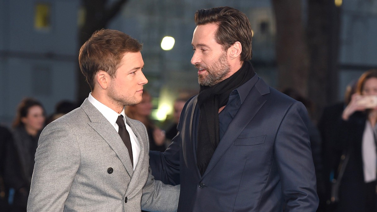 Taron Egerton and Hugh Jackman arrive for the European premiere of 'Eddie The Eagle' at Odeon Leicester Square on March 17, 2016 in London, England.