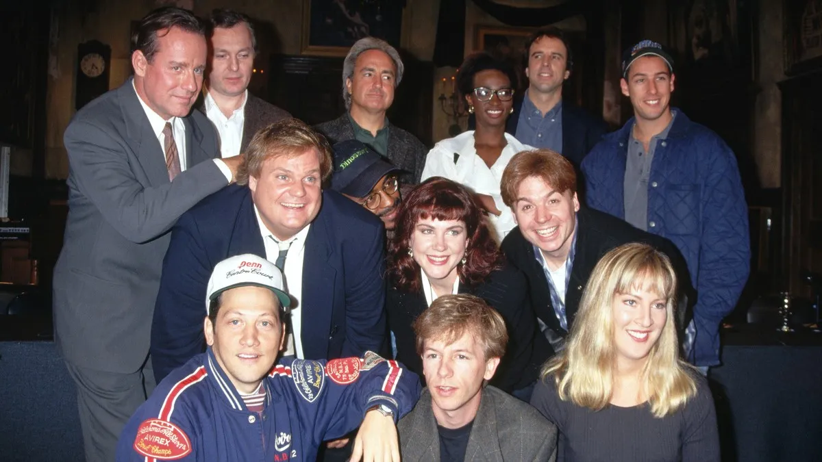 1993-New York, NY-Photo shows the cast of Saturday Night Live posed. Amongst those in the group are: Phil Hartman, Lorne Michaels (Producer), Ellen Kleghorne, Kevin Nealon, Adam Sandler, Chris Farley, Tim Meadows, Mike Myers, Rob Schneider and David Spade.