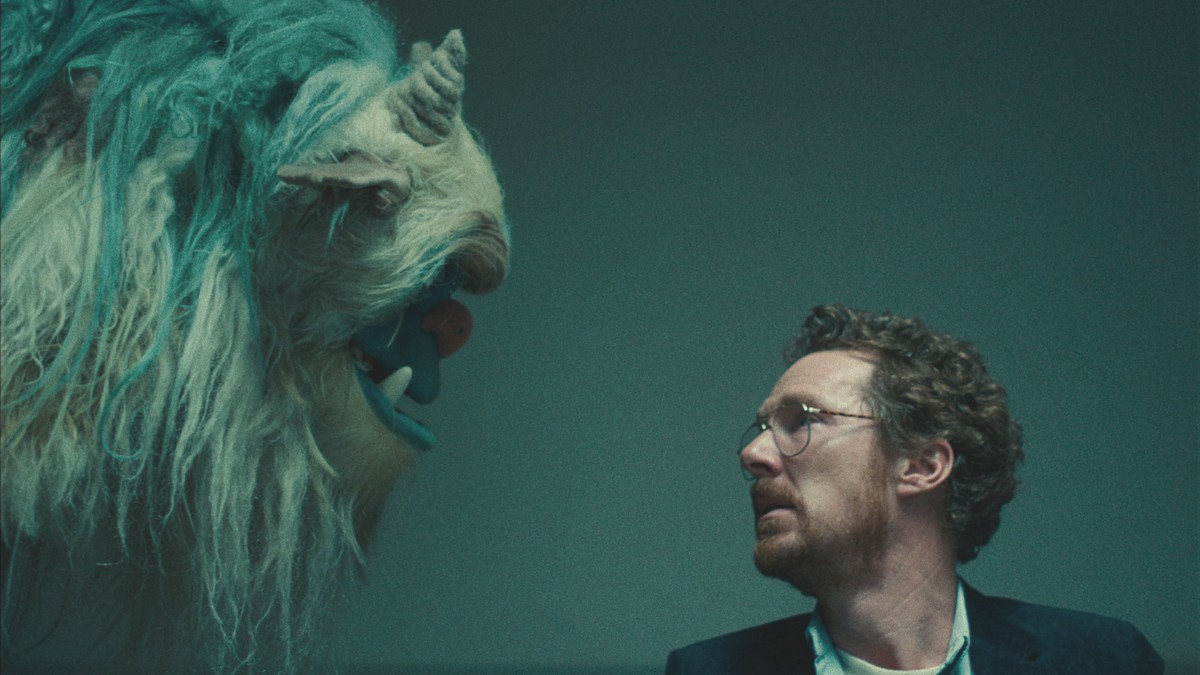 Benedict Cumberbatch looking at a monster puppet in Netflix's Eric
