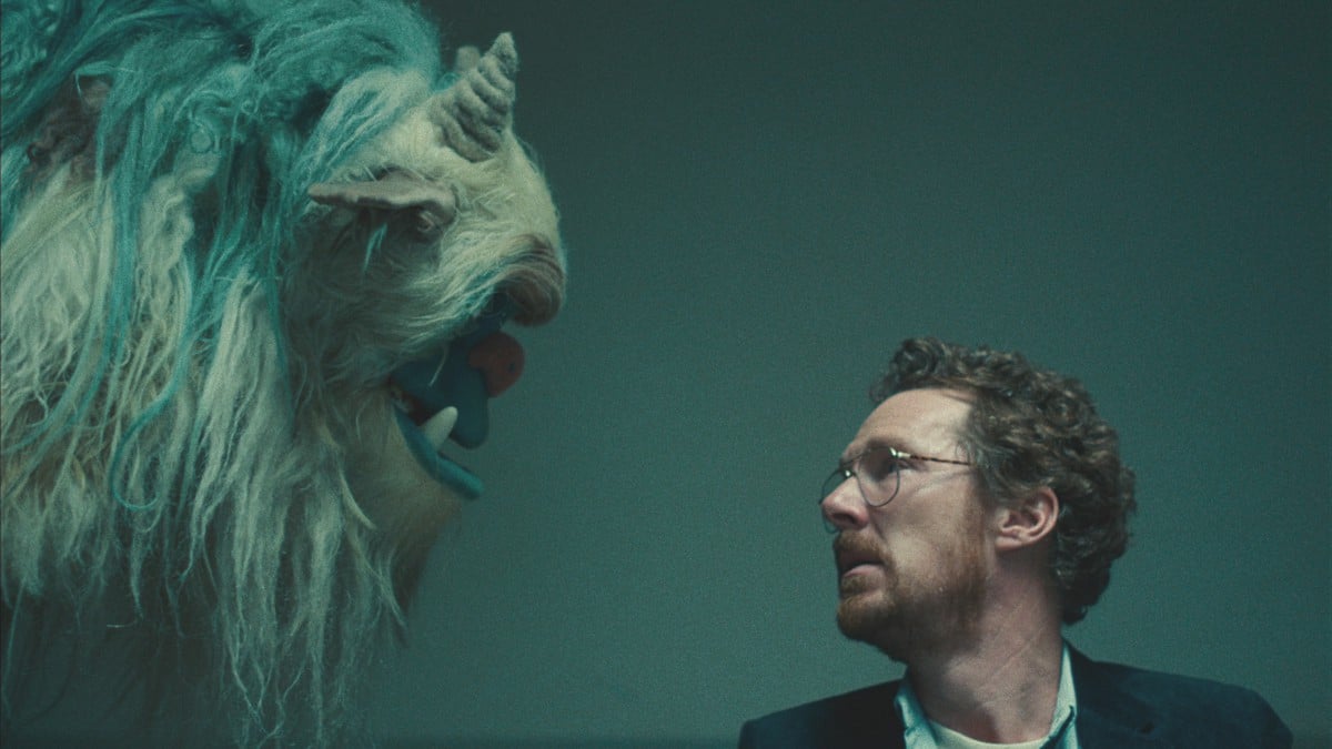 Benedict Cumberbatch looking at a monster puppet in Netflix's Eric