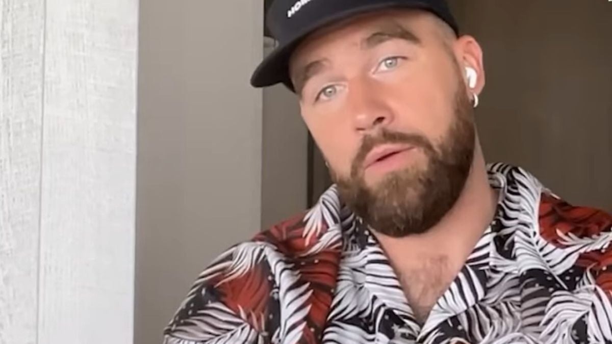 Travis Kelce with a colorful shirt on his New Heights podcast