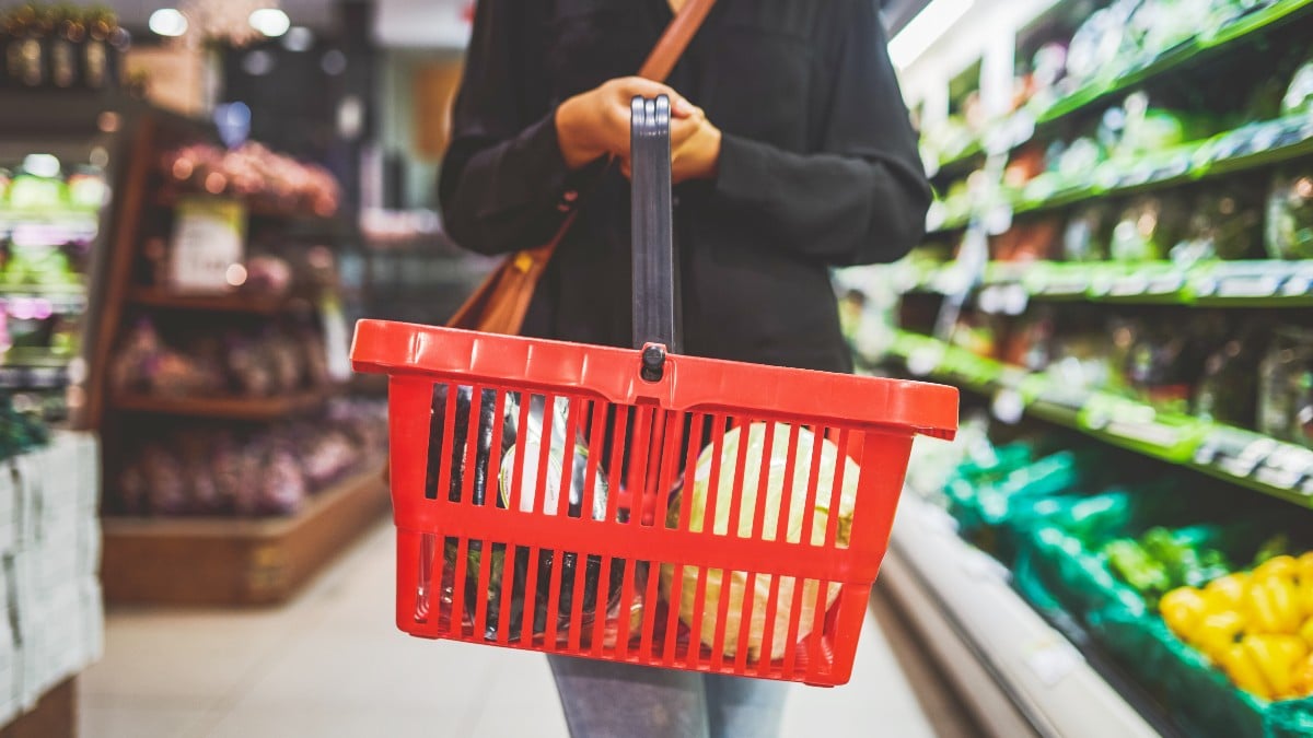 Women in grocery store sign