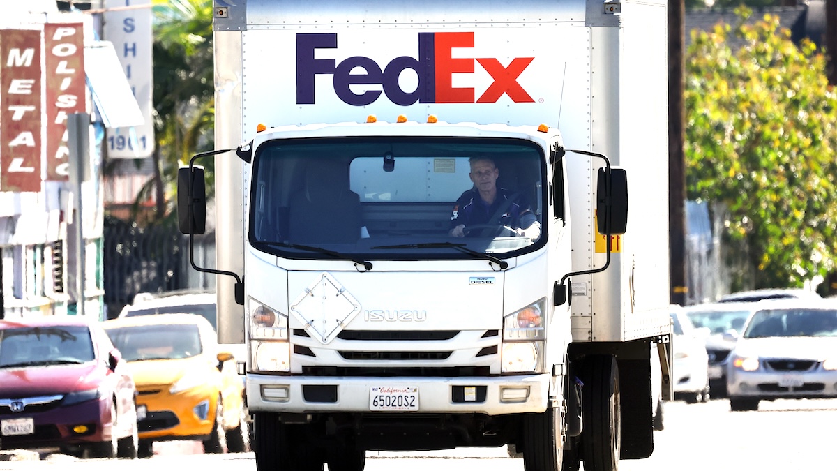 A FedEx truck driving on a sunny day in Los Angeles, CA