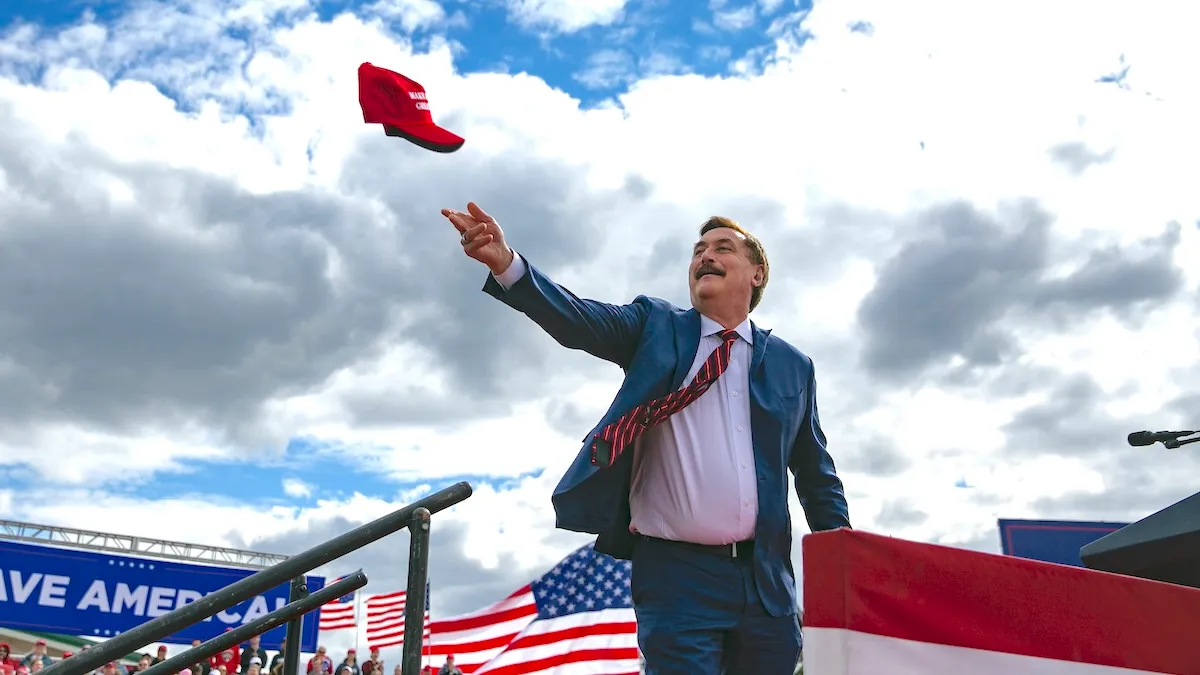 MyPillow CEO Mike Lindell throwing a MAGA hat, for whatever reason