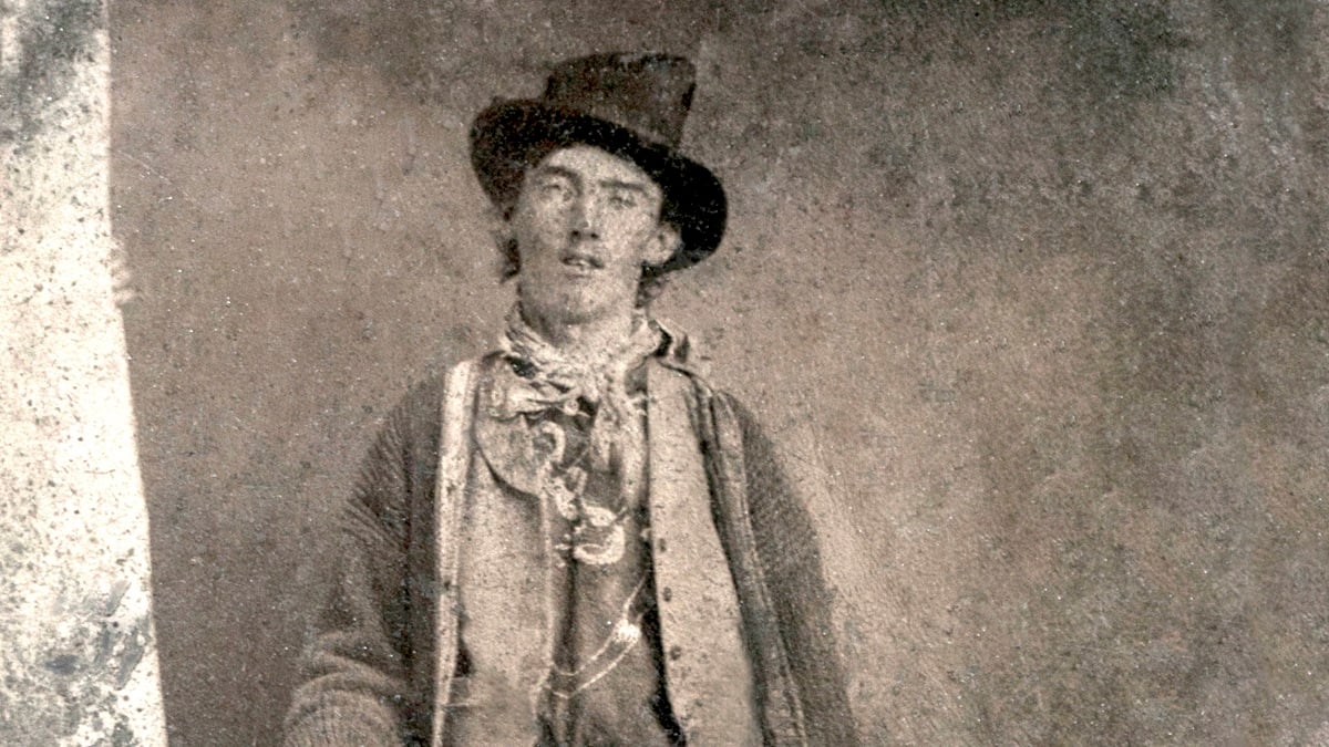 Billy the Kid posing with gun