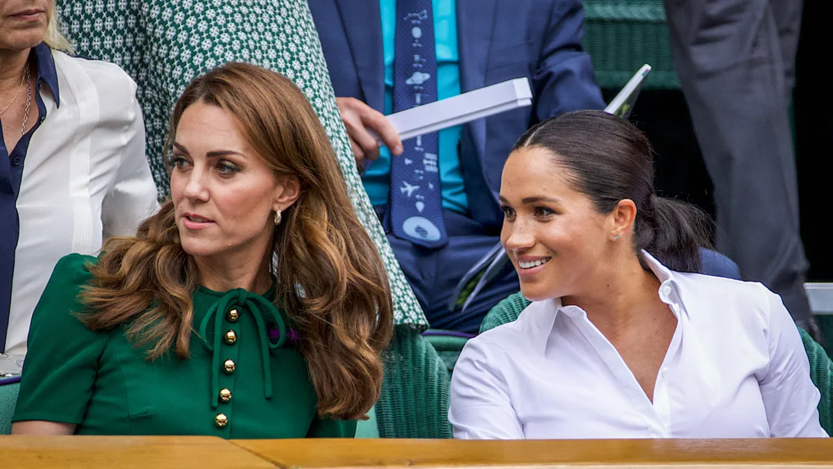Catherine, Duchess of Cambridge sits with Meghan, Duchess of Sussex in the Royal Box on Centre Court ahead of the Ladies Singles Final between Simona Halep of Romania and Serena Williams of the United States on Centre Court during the Wimbledon Lawn Tennis Championships at the All England Lawn Tennis and Croquet Club at Wimbledon on July 13, 2019 in London, England.