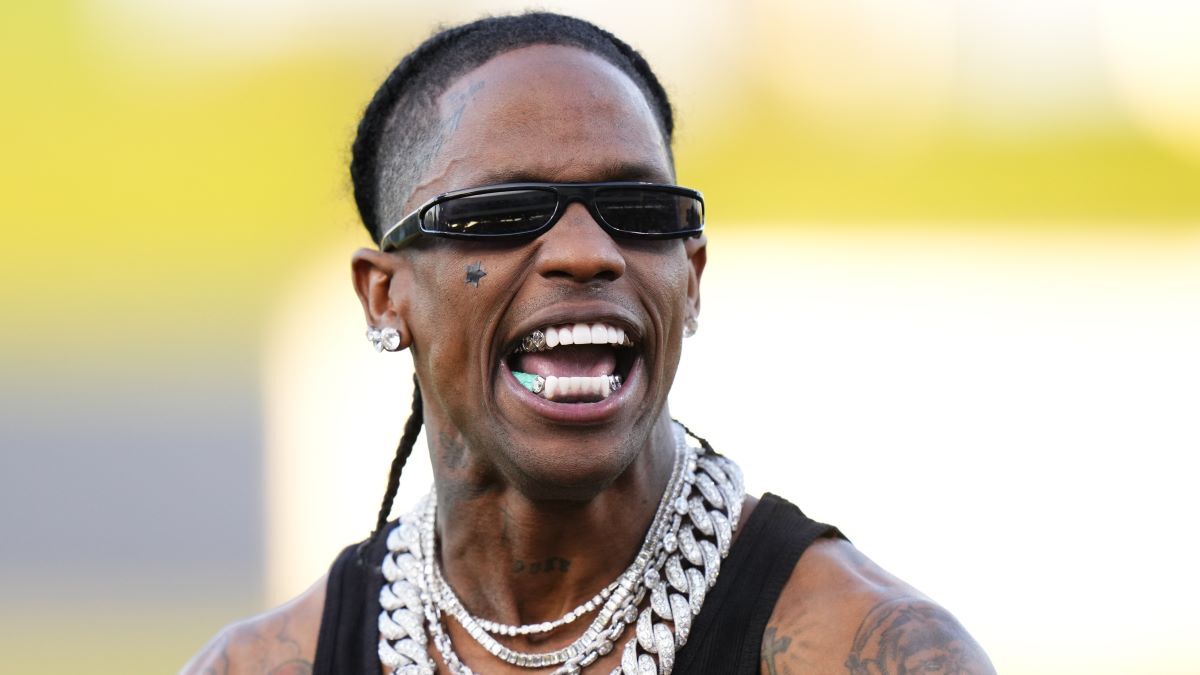 Travis Scott celebrates after throwing the opening pitch prior to a game between the Washington Nationals and the Houston Astros at CACTI Park of the Palm Beaches on February 24, 2024 in West Palm Beach, Florida.