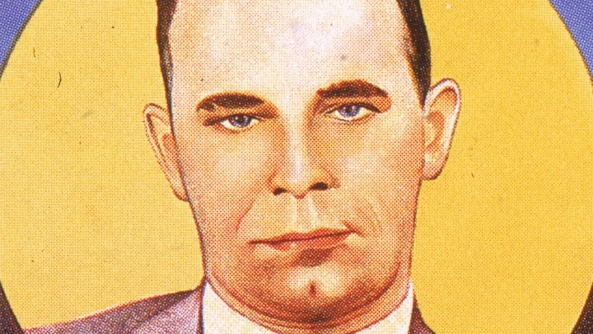 Film poster showing an illustration of American gangster John Dillinger (1902 - 1934) to advertise a short newsreel film called 'Dillinger: Public Enemy No. 1,' 1934. (Hulton Archive/Getty Images)