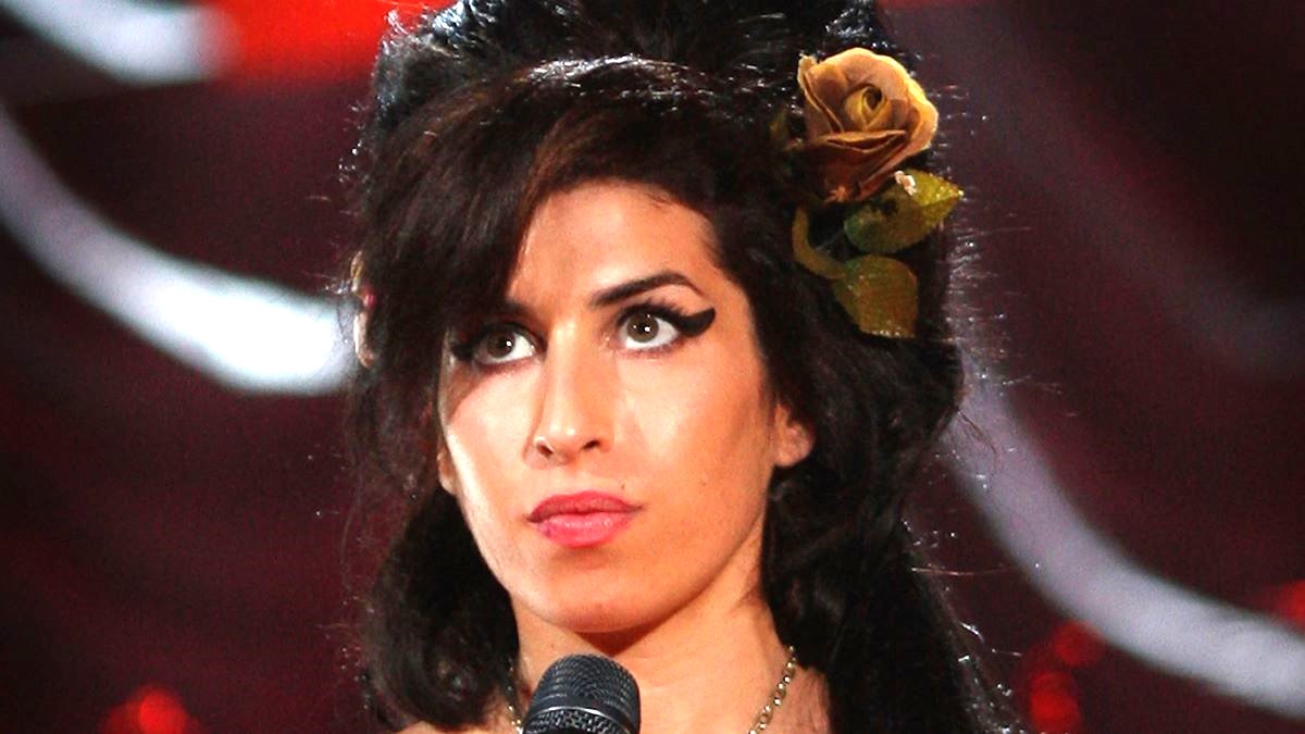 British singer Amy Winehouse performs at the Riverside Studios for the 50th Grammy Awards ceremony via video link on February 10, 2008 in London, England. Winehouse won 5 out of her 6 nominations including, record of the year, best new artist, song of the year, pop vocal album and female pop vocal performance. (Photo by Peter Macdiarmid/Getty Images for NARAS)