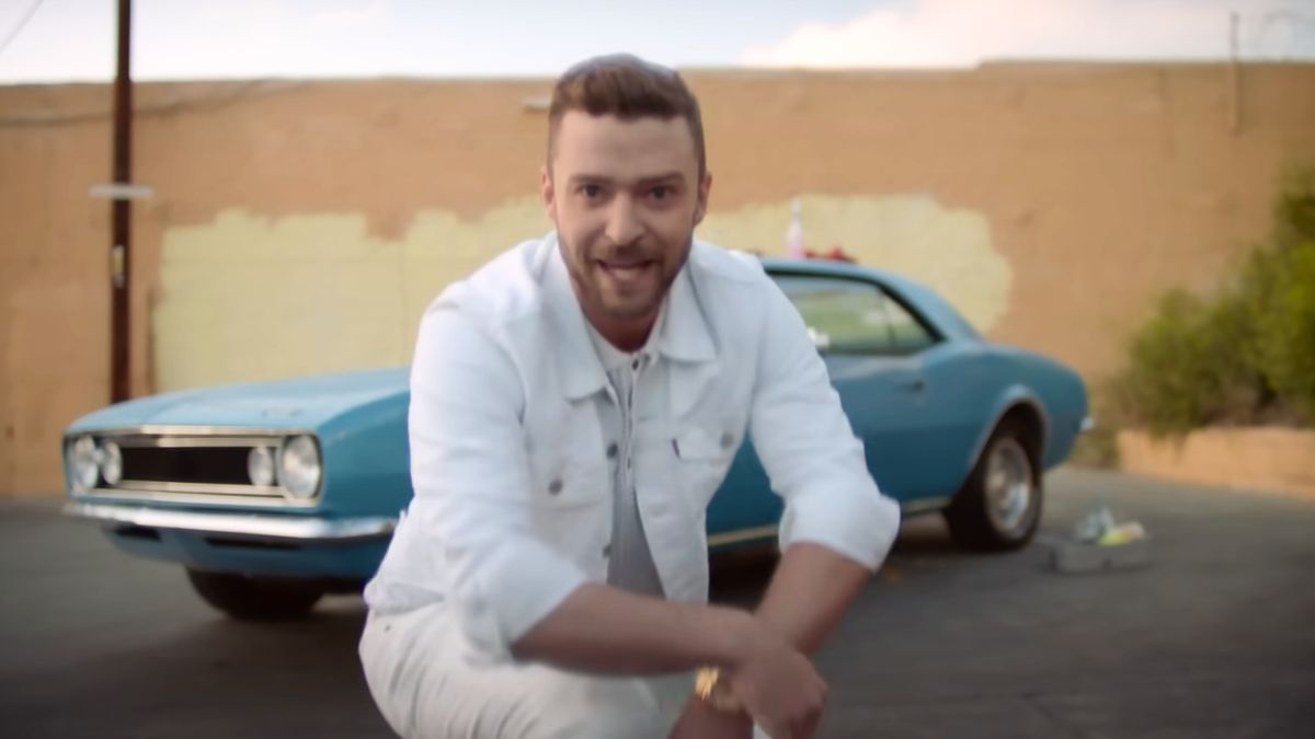 Justin Timberlake with a car in the background in his music video for "Can't Stop the Feeling"