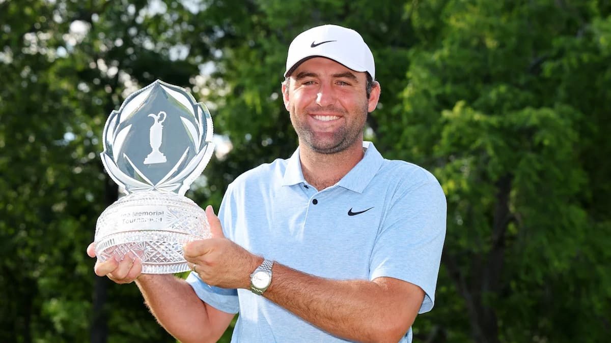 DUBLIN, OHIO - JUNE 09: Scottie Scheffler of the United States poses with the trophy after winning the Memorial Tournament presented by Workday at Muirfield Village Golf Club on June 09, 2024 in Dublin, Ohio.