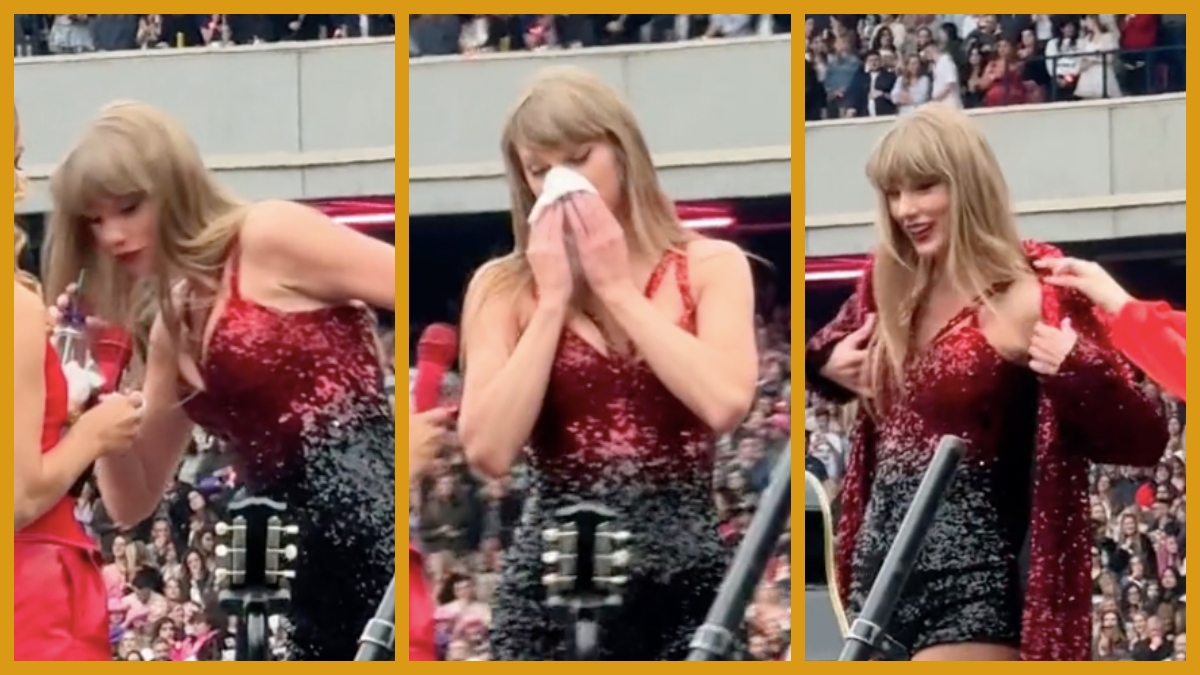 Taylor Swift blows her nose into tissue during a performance