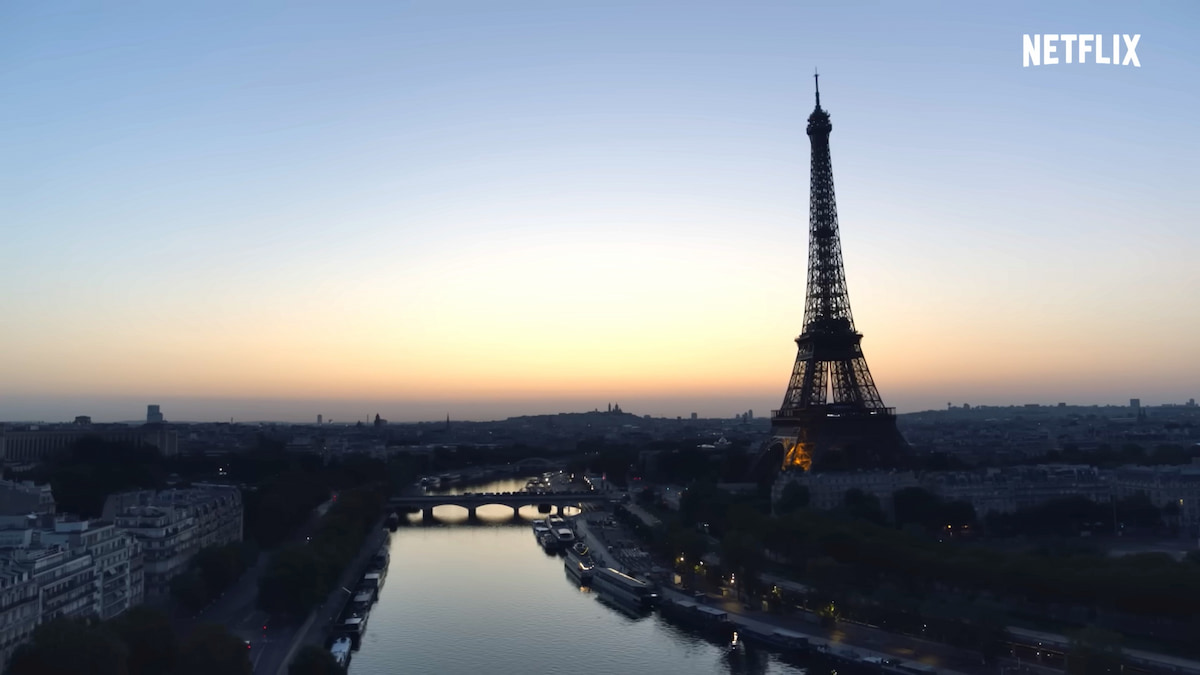 Under Paris' shot showing the Eiffel Tower and Seine.