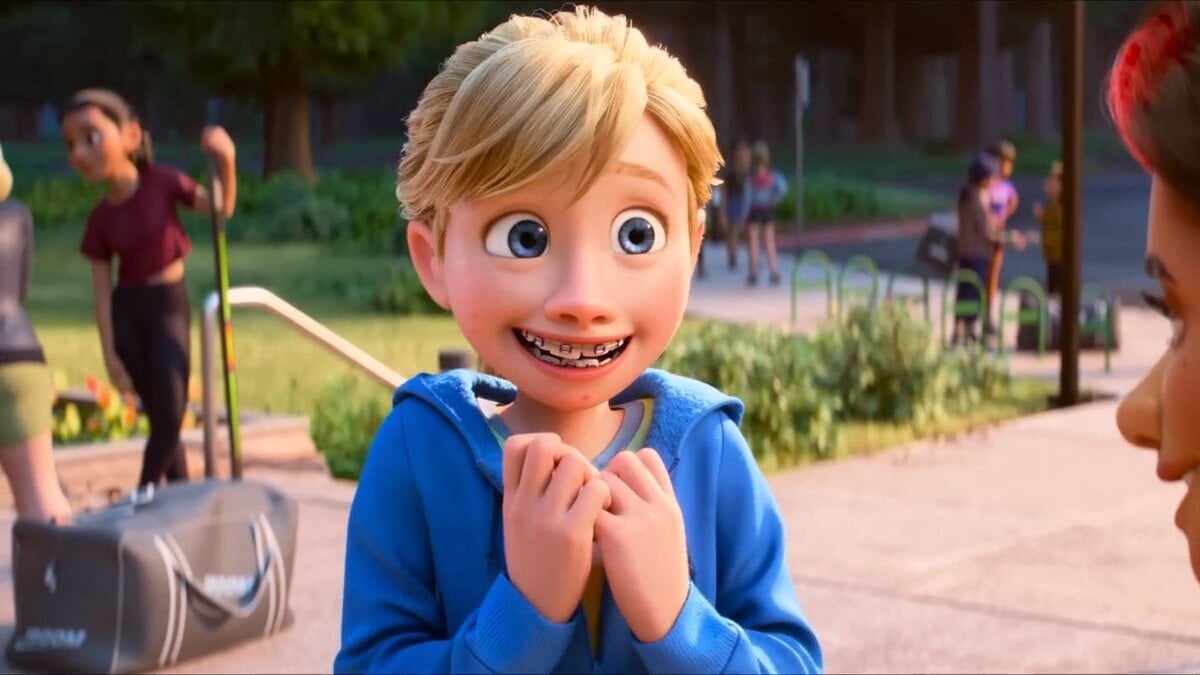 Riley smiling nervously in Inside Out 2.