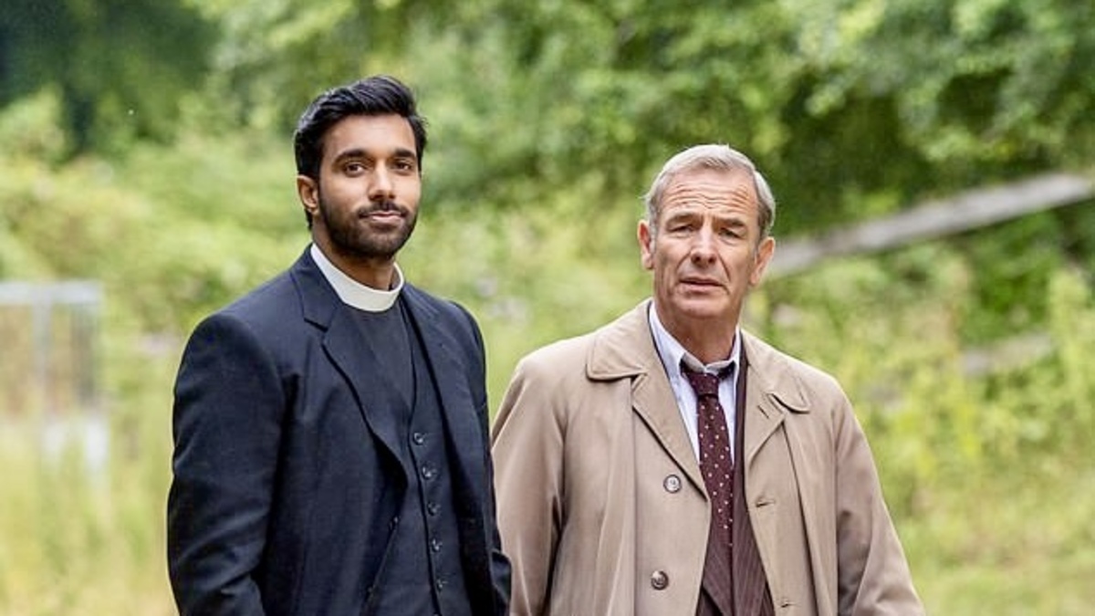 Rishi Nair and Robson Green look at the camera dressed as characters from the British series, ‘Grantchester’