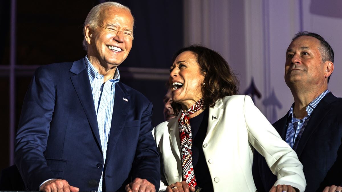 President Joe Biden and Vice President Kamala Harris laugh as they view the fireworks on the National Mall from the White House balcony during a 4th of July event on the South Lawn of the White House on July 4, 2024 in Washington, DC. The President is hosting the Independence Day event for members of the military and their families.