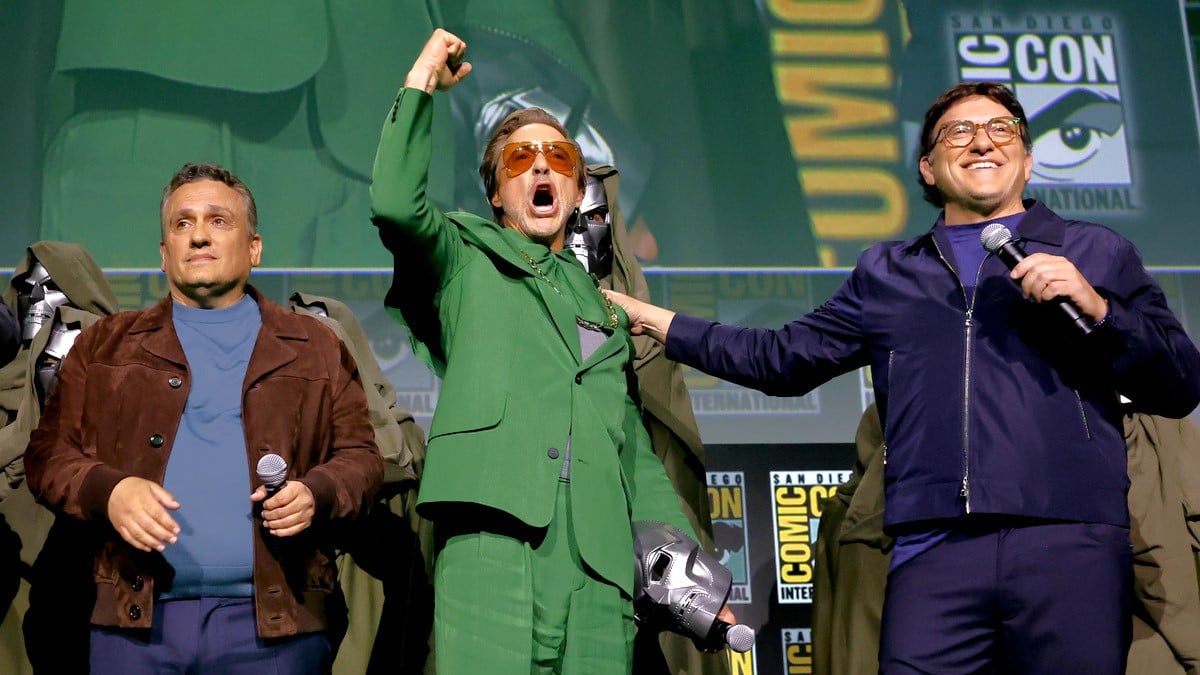 SAN DIEGO, CALIFORNIA - JULY 27: (L-R) Joe Russo, Robert Downey Jr. and Anthony Russo speak onstage during the Marvel Studios Panel in Hall H at SDCC in San Diego, California on July 27, 2024.