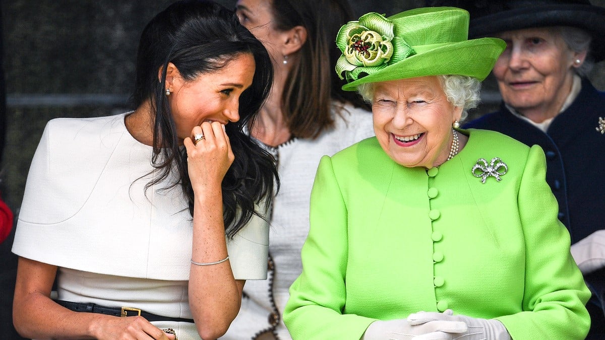 CHESTER, ENGLAND - JUNE 14: Queen Elizabeth II sitts and laughs with Meghan, Duchess of Sussex during a ceremony to open the new Mersey Gateway Bridge on June 14, 2018 in the town of Widnes in Halton, Cheshire, England. Meghan Markle married Prince Harry last month to become The Duchess of Sussex and this is her first engagement with the Queen. During the visit the pair will open a road bridge in Widnes and visit The Storyhouse and Town Hall in Chester. 