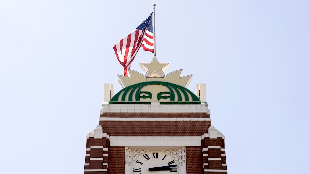 The American flag flying atop a logo at the Starbucks headquarters at Starbucks Center