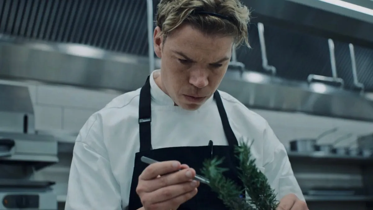 Will Poulter in The Bear as Luca, cooking in a kitchen