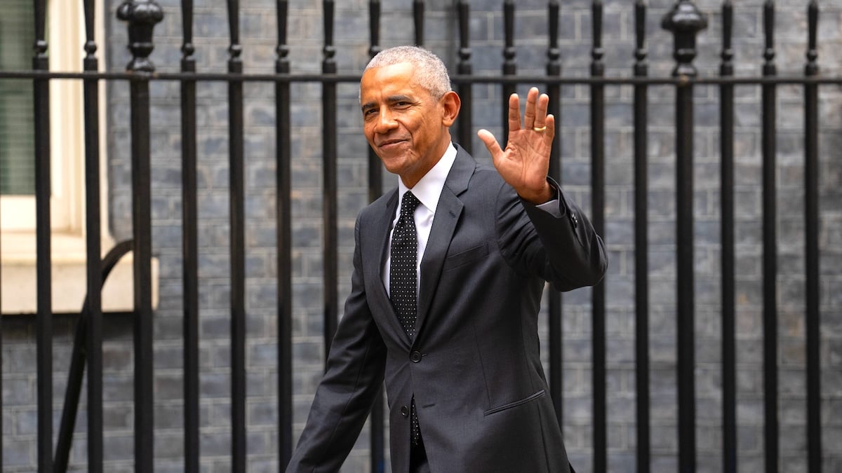 Barack Obama waving to cameras in London, England.