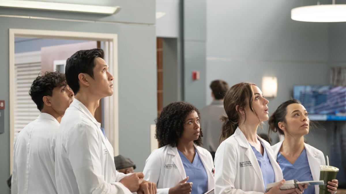 The interns in Grey's Anatomy season 20 looking at something