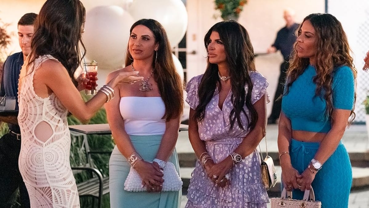 The cast of The Real Housewives of New Jersey standing and talking to each other