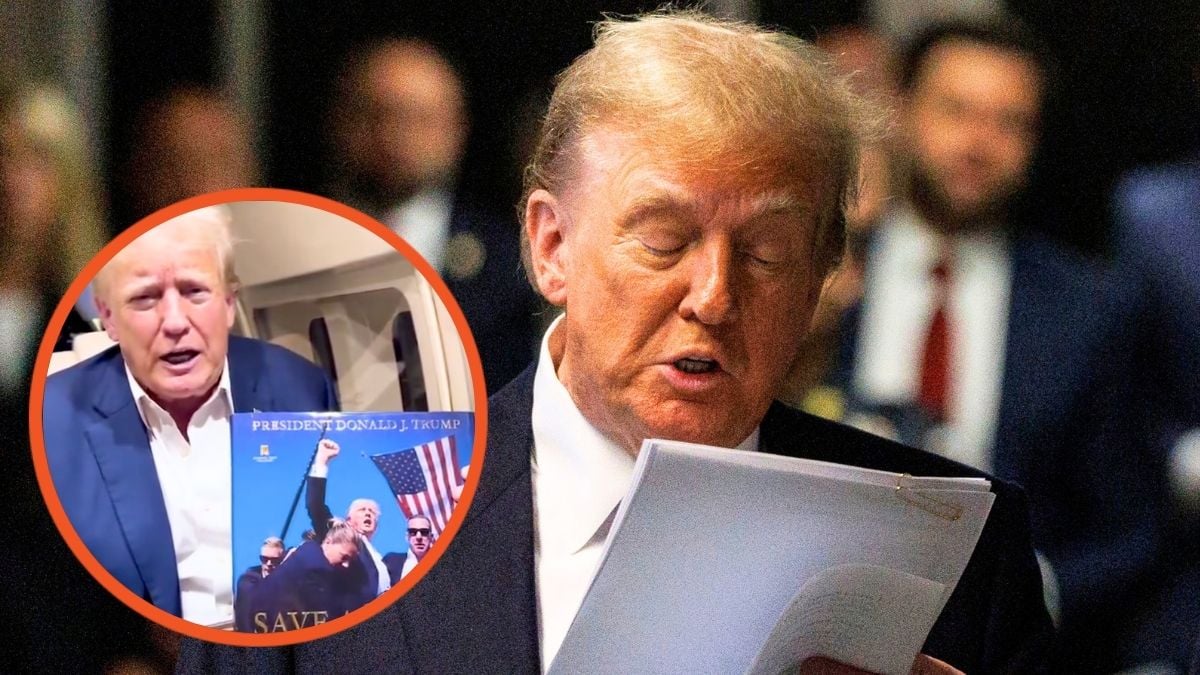 Donald Trump reads from a printout of a New York Times article before entering the courtroom for his trial