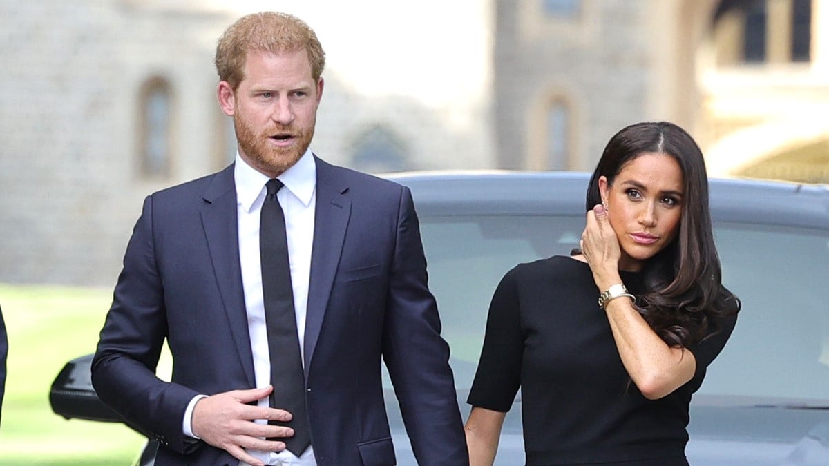 Prince Harry, Duke of Sussex, and Meghan, Duchess of Sussex arrive on the long Walk at Windsor Castle arrive to view flowers and tributes to HM Queen Elizabeth on September 10, 2022 in Windsor, England. Crowds have gathered and tributes left at the gates of Windsor Castle to Queen Elizabeth II, who died at Balmoral Castle on 8 September, 2022.