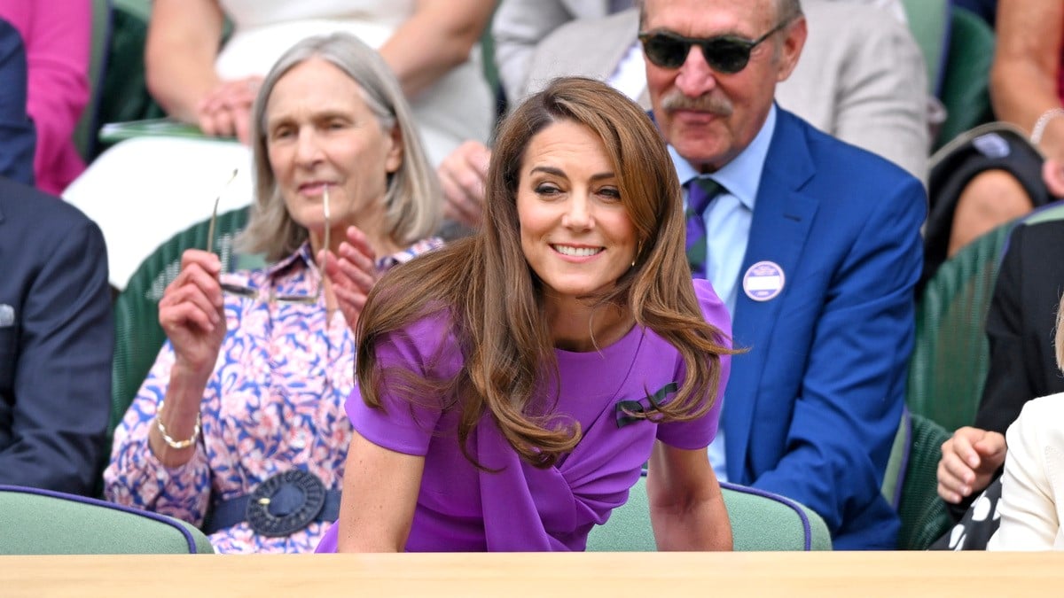 Catherine Princess of Wales laughing court-side of Centre Court during the men's final on day fourteen of the Wimbledon Tennis Championships at the All England Lawn Tennis and Croquet Club on July 14, 2024 in London, England.