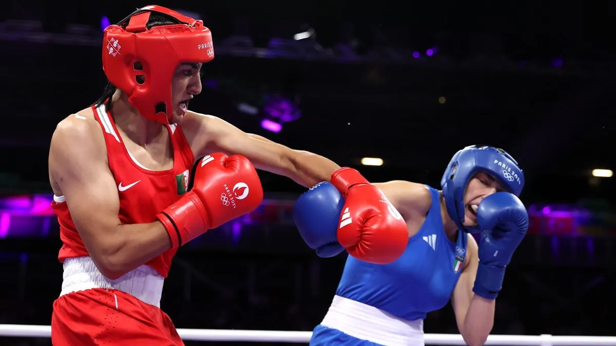 Imane Khelif of Team Algeria and Angela Carini of Team Italy exchange punches during the Women's 66kg preliminary round match on day six of the Olympic Games Paris 2024 at North Paris Arena on August 01, 2024 in Paris, France. (Photo by Richard Pelham/Getty Images)