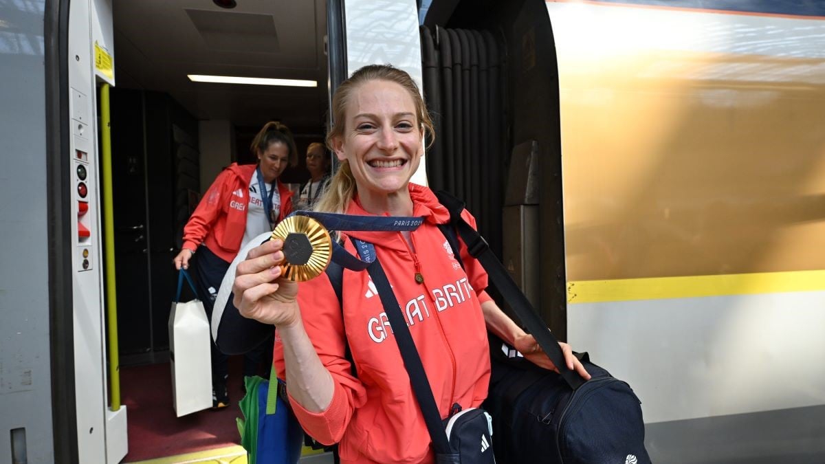 LONDON, ENGLAND - AUGUST 12: Gymnast Bryony Page proudly displays her gold medal, upon her arrival back in the UK via Eurostar at St Pancras International Station on August 12, 2024 in London, England. (Photo by Leon Neal/Getty Images)