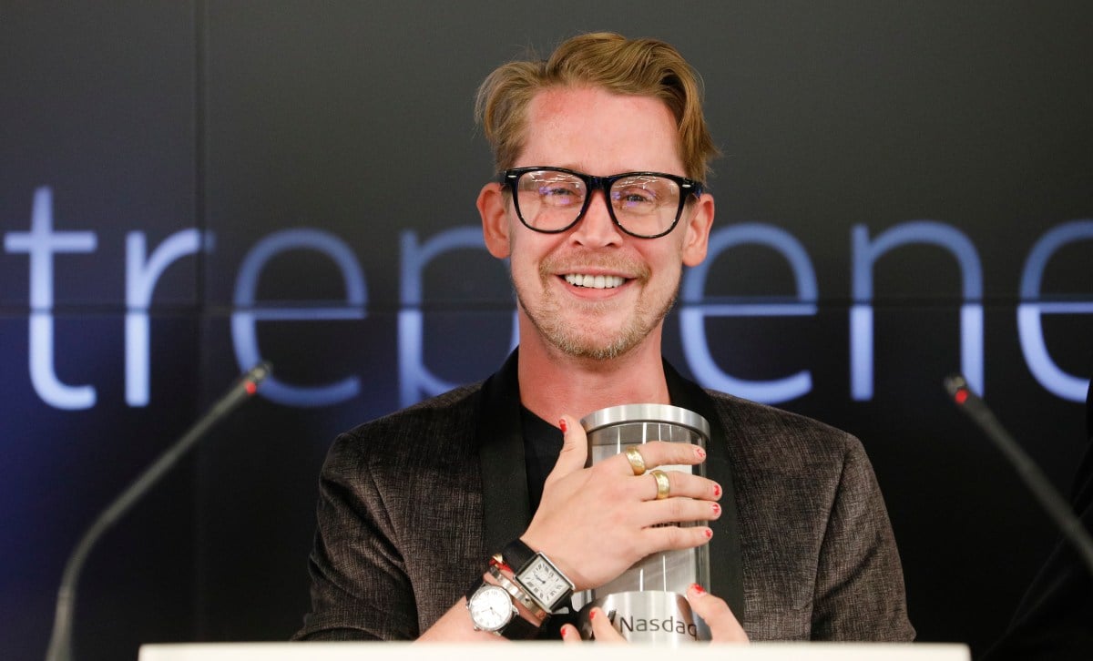 SAN FRANCISCO, CA - AUGUST 06: Macaulay Culkin, co-founder of lifestyle media Bunny Ears, is the honorary bell ringers of the Nasdaq Closing Bell from the Nasdaq Entrepreneurial Center on August 6, 2019 in San Francisco, California. They were joined by the graduating class of the Lehigh Startup Academy and Jeff Thomas of Nasdaq (Back L) (Photo by Kimberly White/Getty Images for Nasdaq Entrepreneurial Center) Macaulay Culkin and Stewart Miller, co-founders of Lifestyle Media Bell Ringers of the Nasdaq Closing Bell from the Nasdaq Entrepreneurial Center in San Francisco, joined by the Graduating Class of the Lehigh Startup Academy