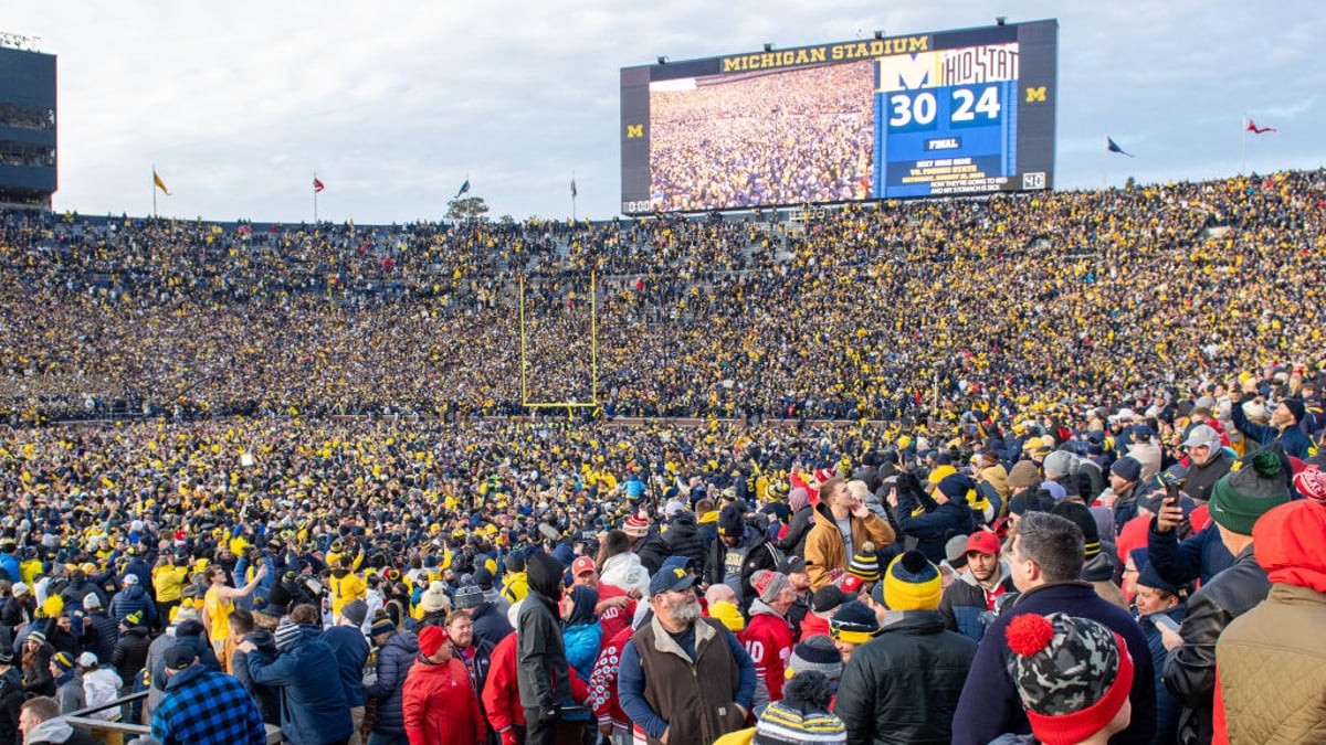 A general view of fans celebrating and rushing the field after a college football game between the Michigan Wolverines and Ohio State Buckeyes at Michigan Stadium on November 25, 2023 in Ann Arbor, Michigan. The Michigan Wolverines won the game 30-24 to win the Big Ten East.