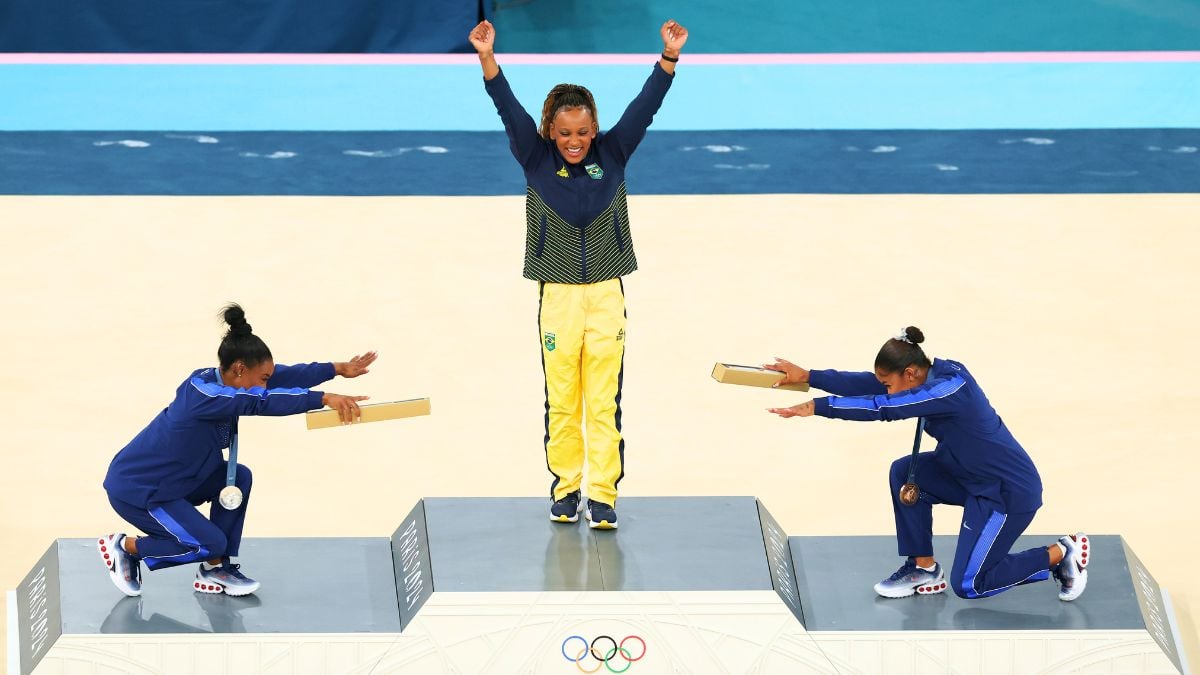 Gold medalist Rebeca Andrade (C) of Team Brazil, silver medalist Simone Biles (L) of Team United States and bronze medalist Jordan Chiles (R) of Team United States celebrate on the podium at the Artistic Gymnastics Women's Floor Exercise Medal Ceremony on day ten of the Olympic Games Paris 2024 at Bercy Arena on August 05, 2024 in Paris, France.