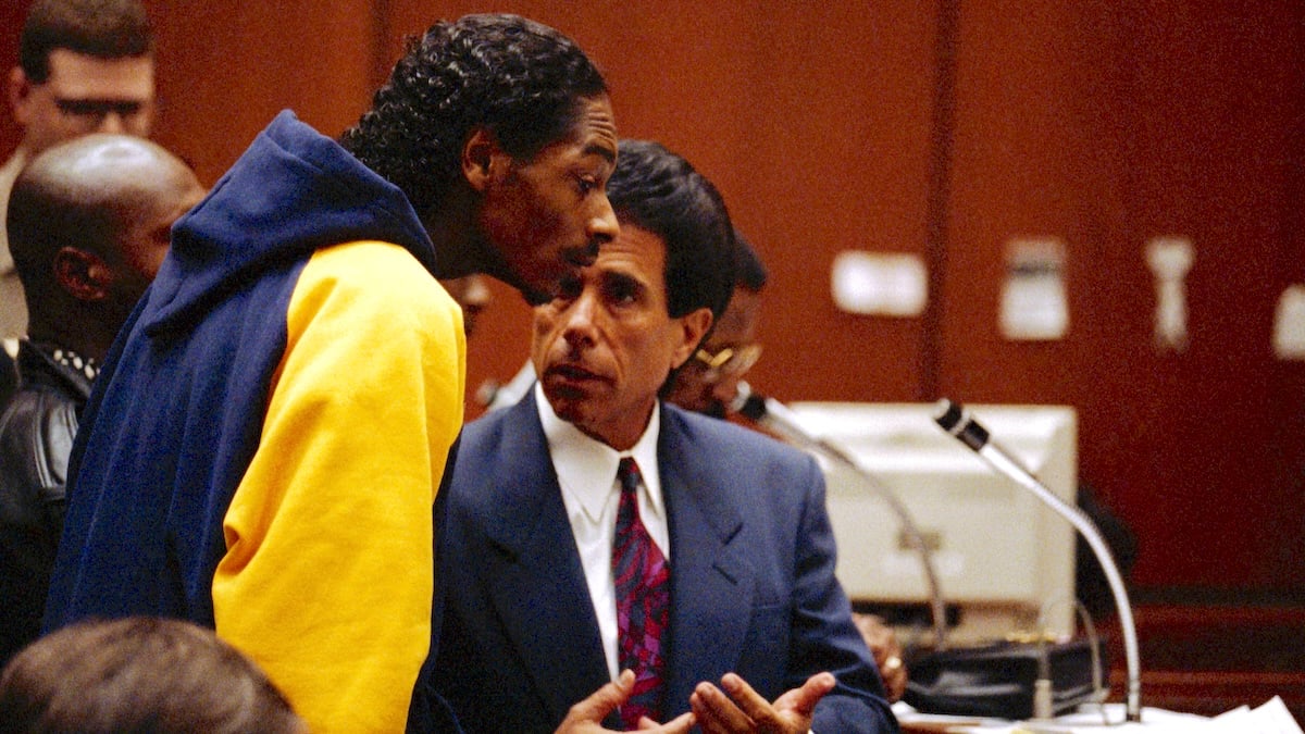 An attorney for Calvin Broadus, more commonly known as Snoop Doggy Dogg, talks to his client during his arraignment on murder charges at the Los Angeles Superior Court's Criminal Court Building